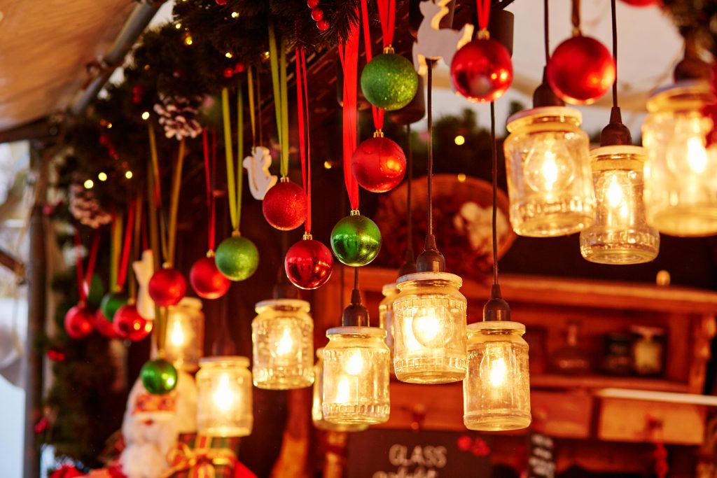 Colorful Christmas decorations and glass lanterns on a Parisian Christmas market